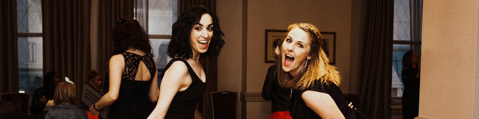 two women smiling at camera