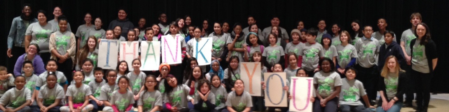 Large group of First Stage Theater Academy students holding signs spelling the words "Thank You"
